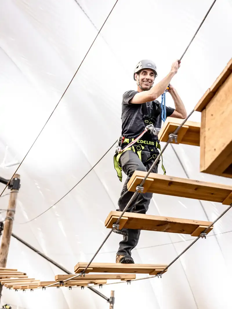 Guest crossing the ropes course