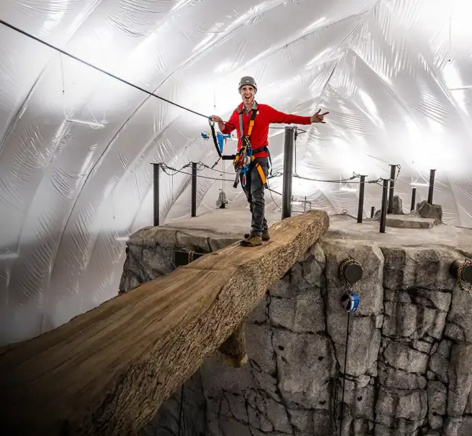 Group climbing the indoor mountain