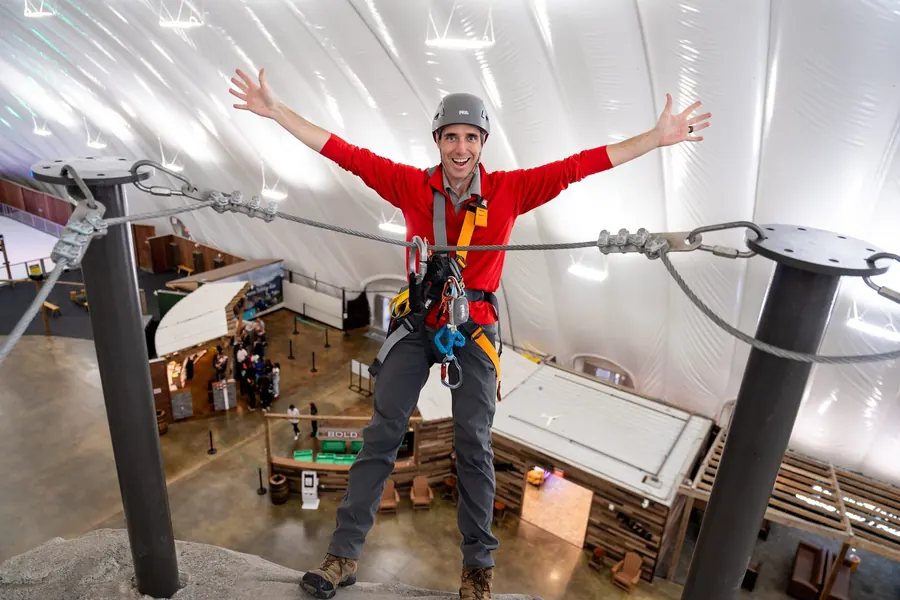 Guest on the ropes course high above the park